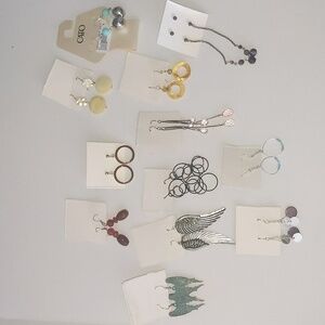 Lot of 12 sets of earrings. Costume/ angel wings/dangle/previously worn
